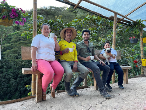 Cupping a coffee processed as a team, El Rincon Farm, Huila, Colombia. From left to right: Rosaura, Martín, Manolo, Jesus, and his dog Tabi.